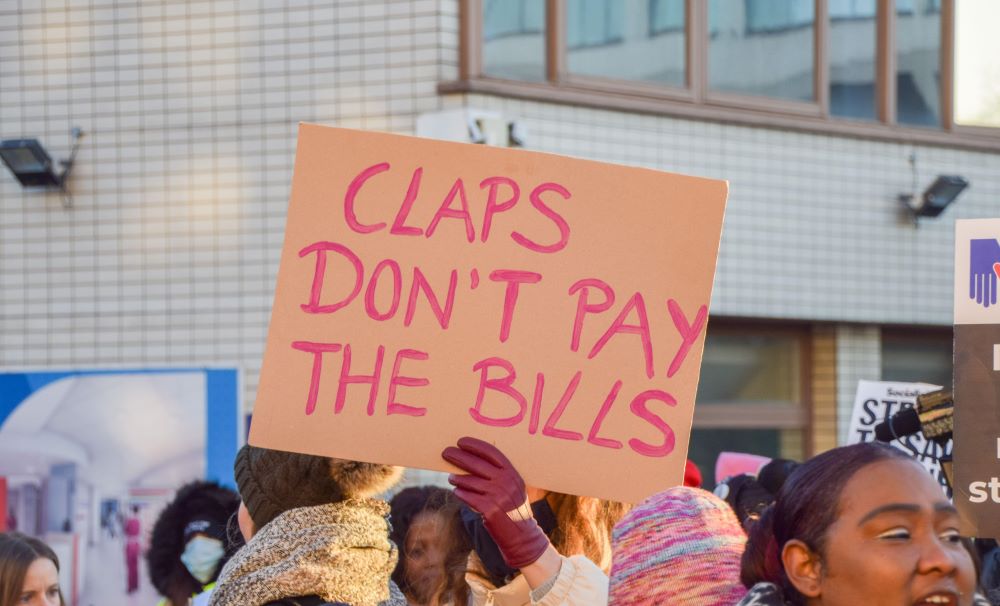 Nurse holding a sign on the picket line